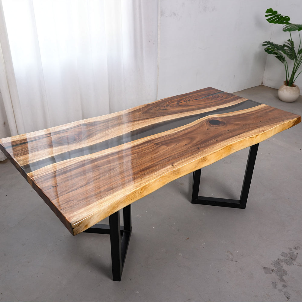 Solid wood dining table featuring natural knots and a deep obsidian resin center channel.