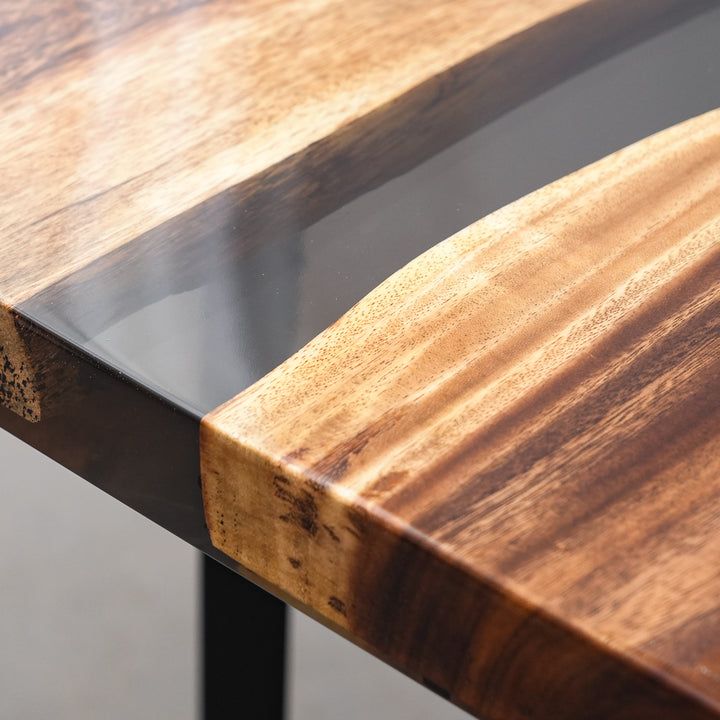 Durable and food-safe matte finish on a professional-grade epoxy resin river table.