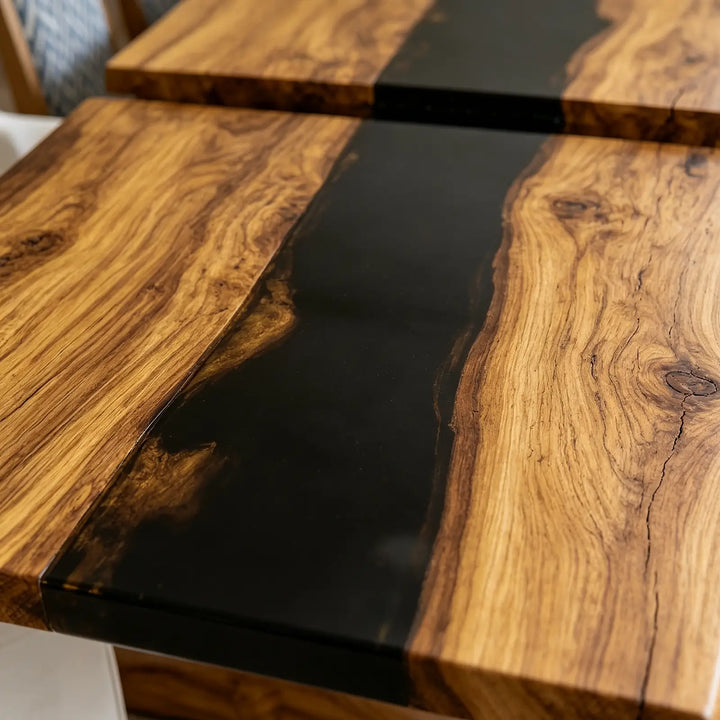 Modern folding epoxy dining table with warm brown wood grain