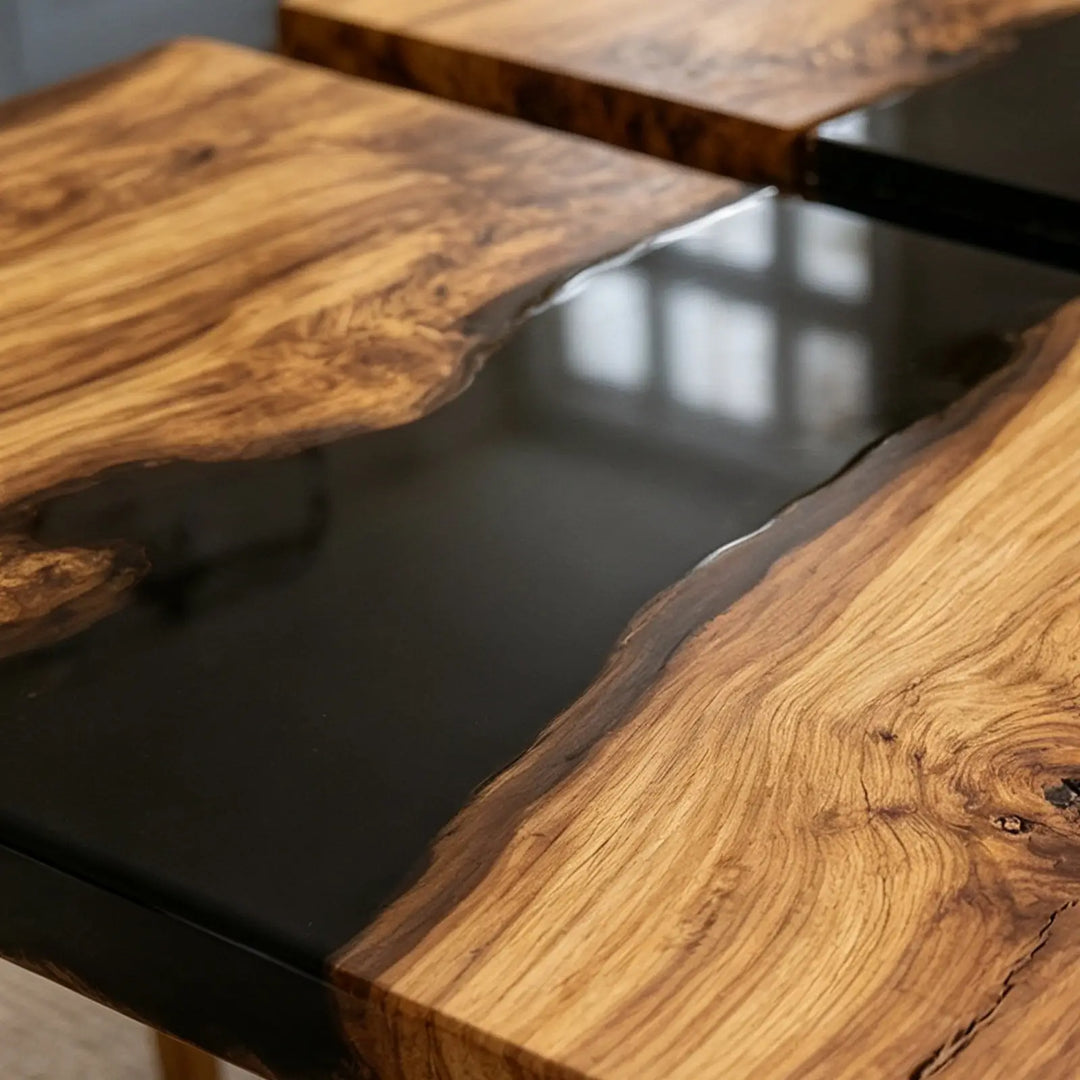 Space-saving folding wood dining table with black resin details
