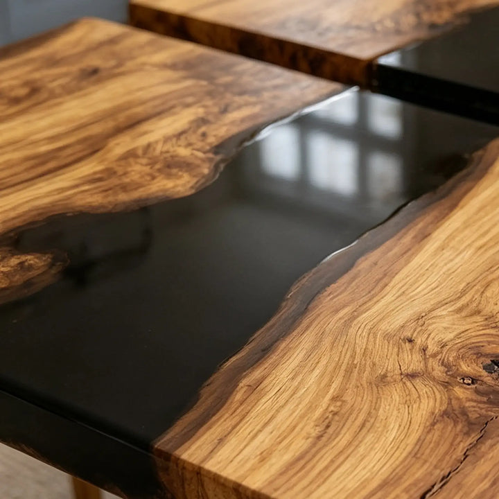 Space-saving folding wood dining table with black resin details