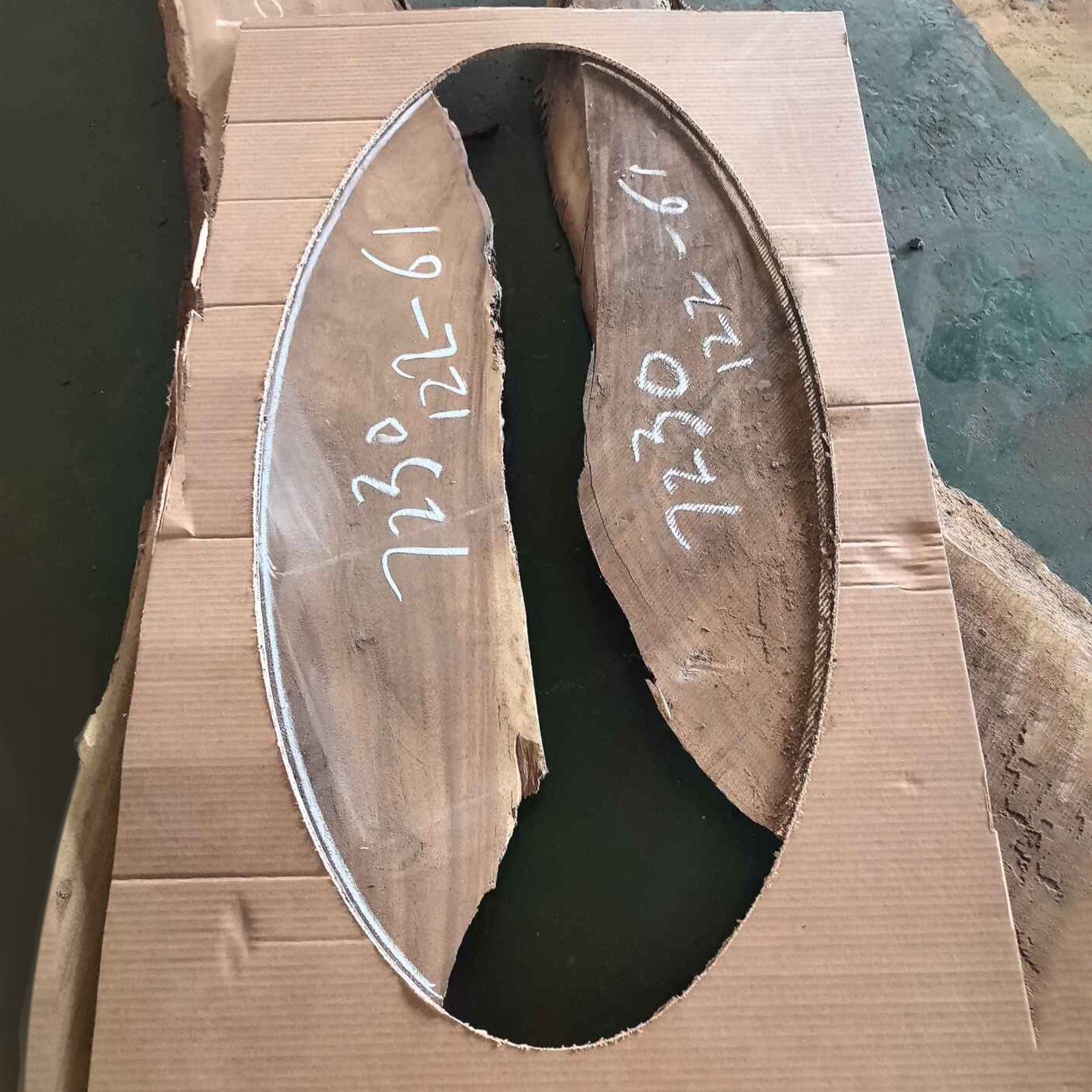 Top view of handcrafted oval walnut coffee table with Ocean Serenity resin river, showcasing natural wood grain and flowing resin.