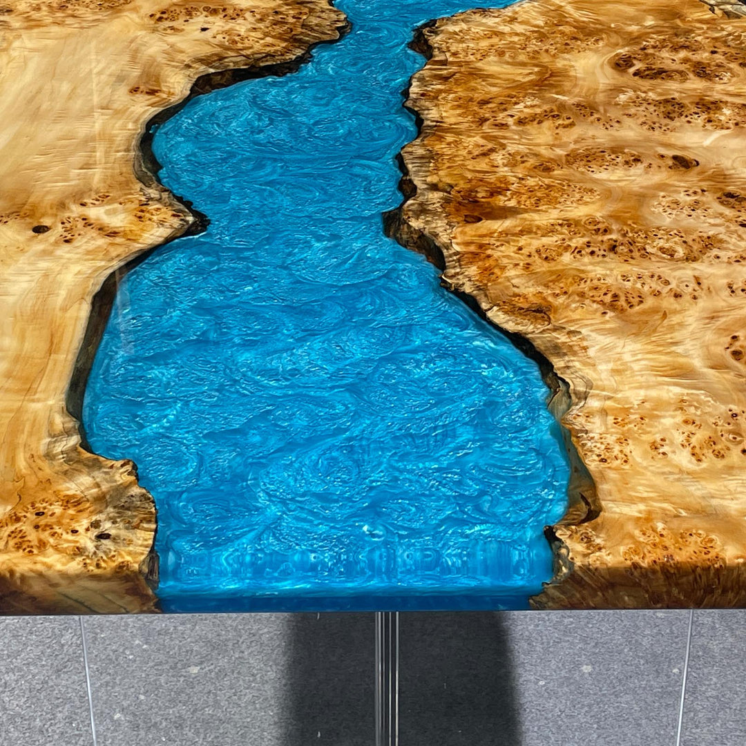 Close-up of poplar burl wood grain on epoxy river tabletop