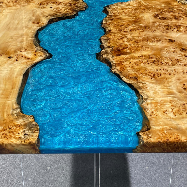 Close-up of poplar burl wood grain on epoxy river tabletop