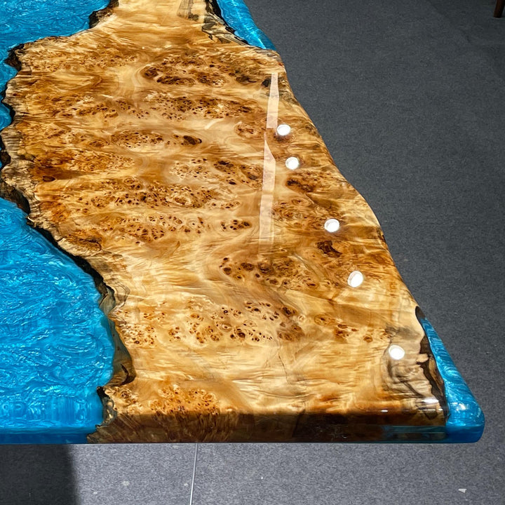 High-gloss blue epoxy resin surface with swirling ocean-like patterns