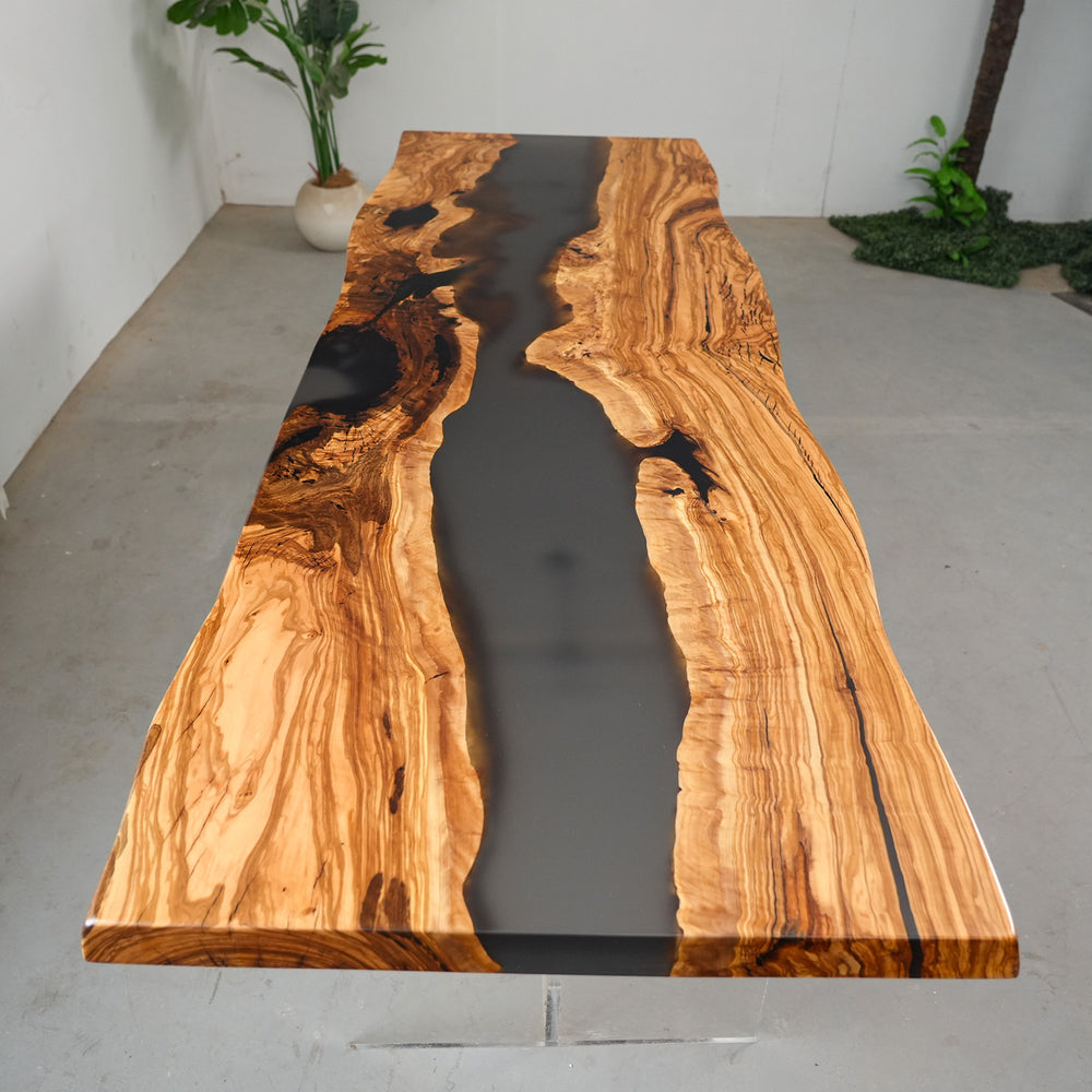 Close-up grain detail of olive wood epoxy river table