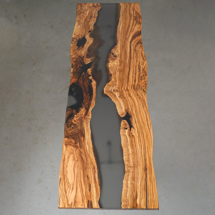 Modern black epoxy river flowing through live edge olive slabs