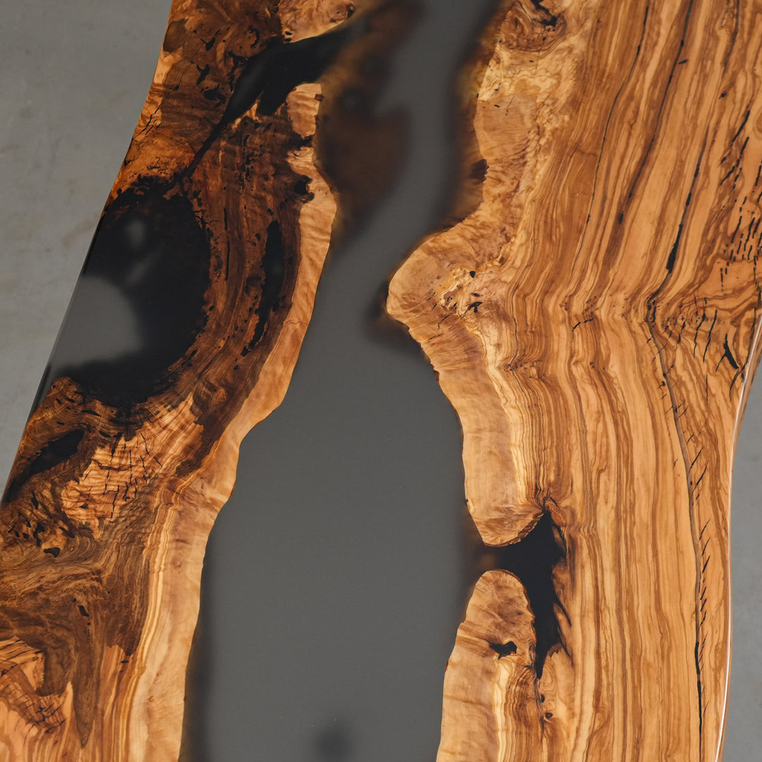 Natural live edge olive wood tabletop with matte epoxy finish