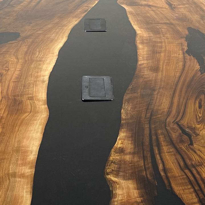 Custom epoxy river conference table with built in power for meetings