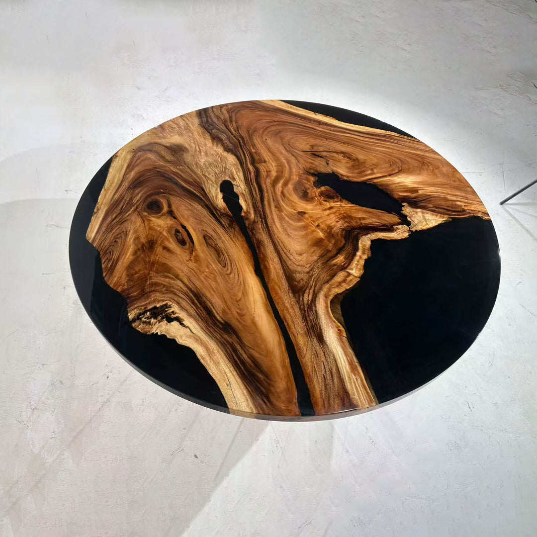 Luxury olive wood round table with flowing black epoxy river