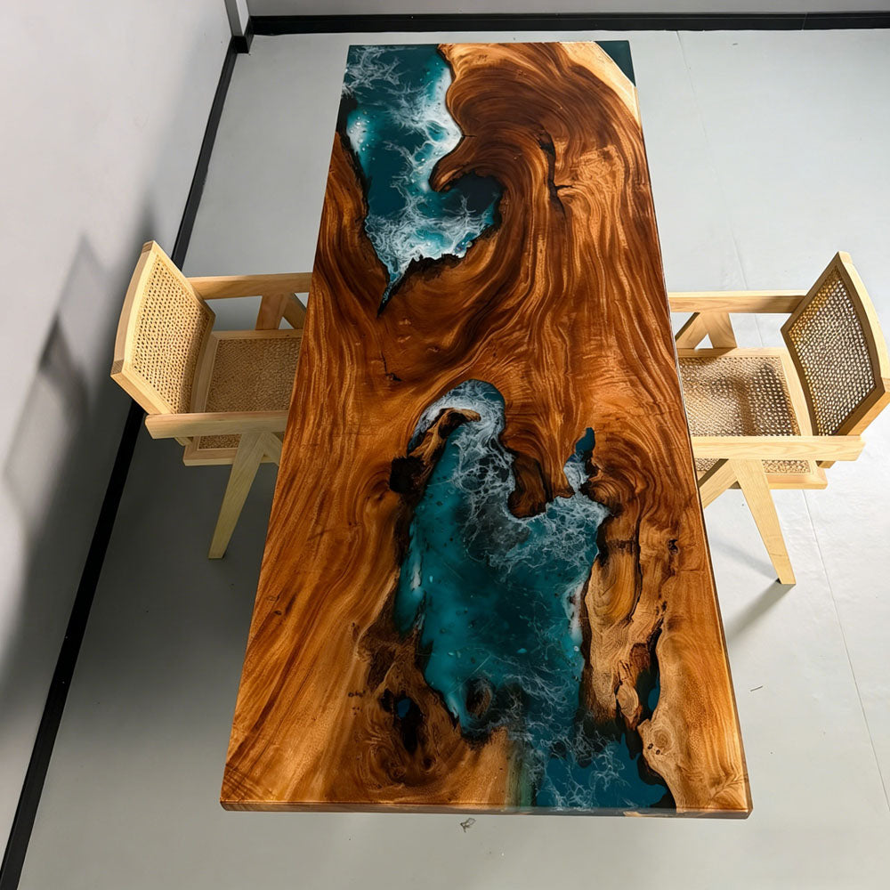 Top view of CRT-272 Malibu luxury walnut dining table featuring a deep blue epoxy resin ocean wave with white seafoam and natural live edge wood grain.