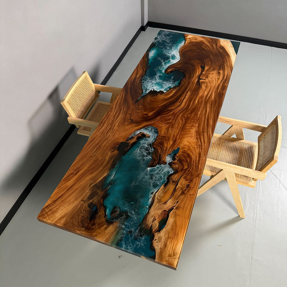 High-gloss polished surface of walnut ocean resin table CRT-272 reflecting light, highlighting the depth of the blue epoxy and natural wood grain.