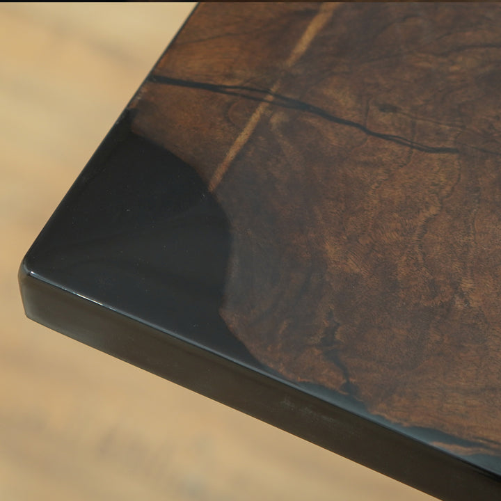 Live edge walnut dining table with opaque black resin river