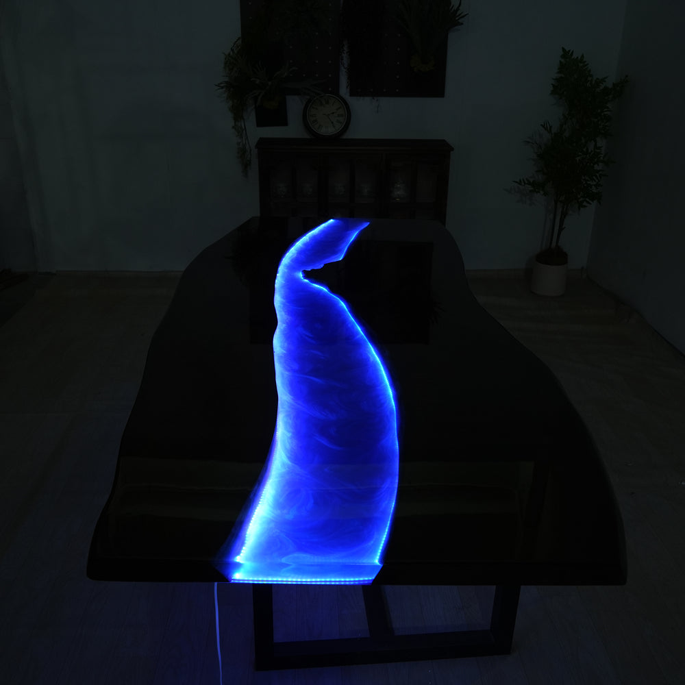 Handcrafted walnut resin river table with glowing LED effect for dining room