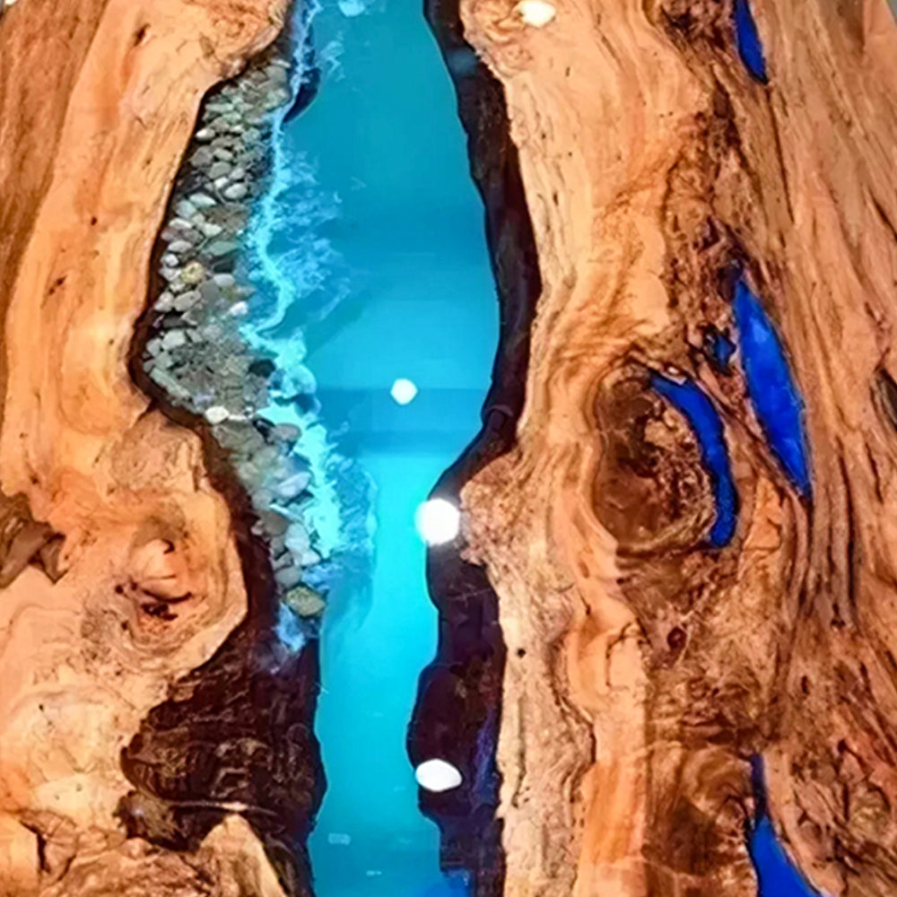 Live edge wood dining table with resin river centerpiece.