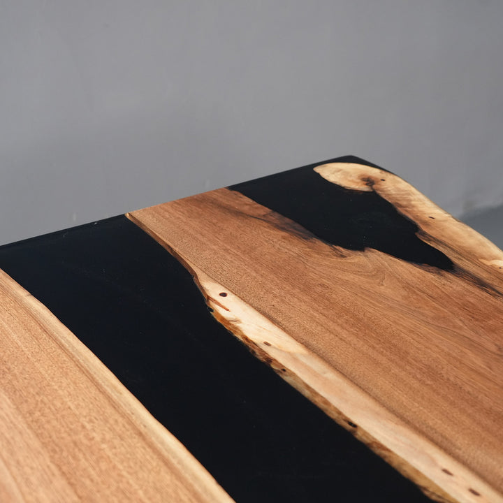 Wooden surface with black resin inlay 