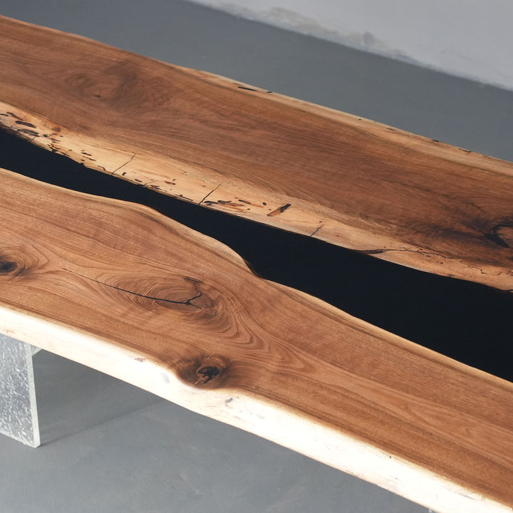 Designer wooden table with epoxy river detail and natural live edge finish