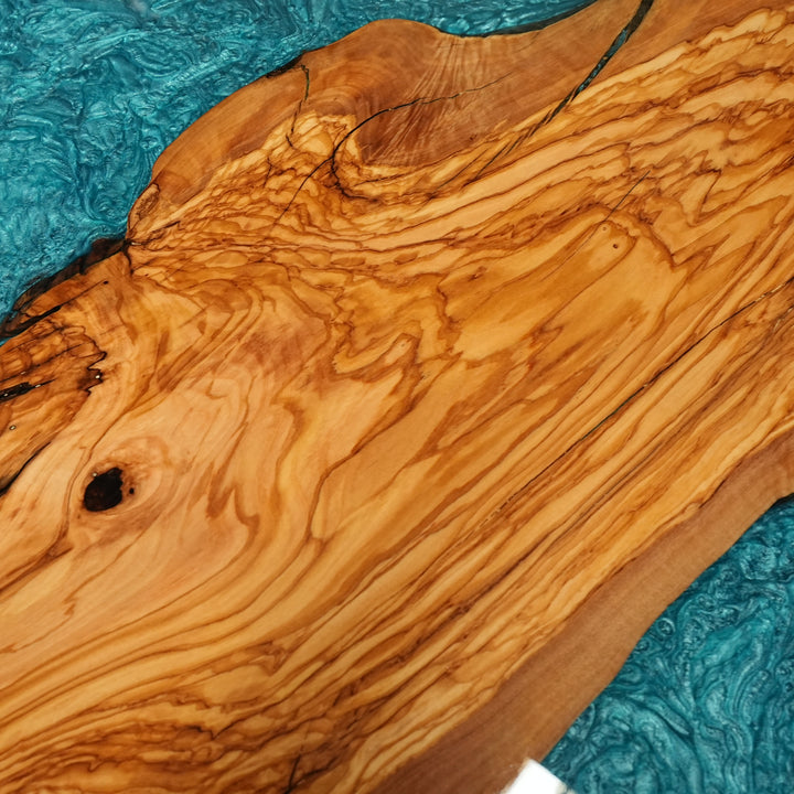 Modern epoxy resin table with live edge olive wood top