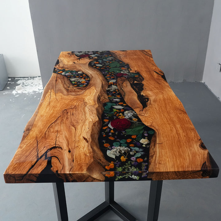 Luxury epoxy river table featuring colorful preserved flowers