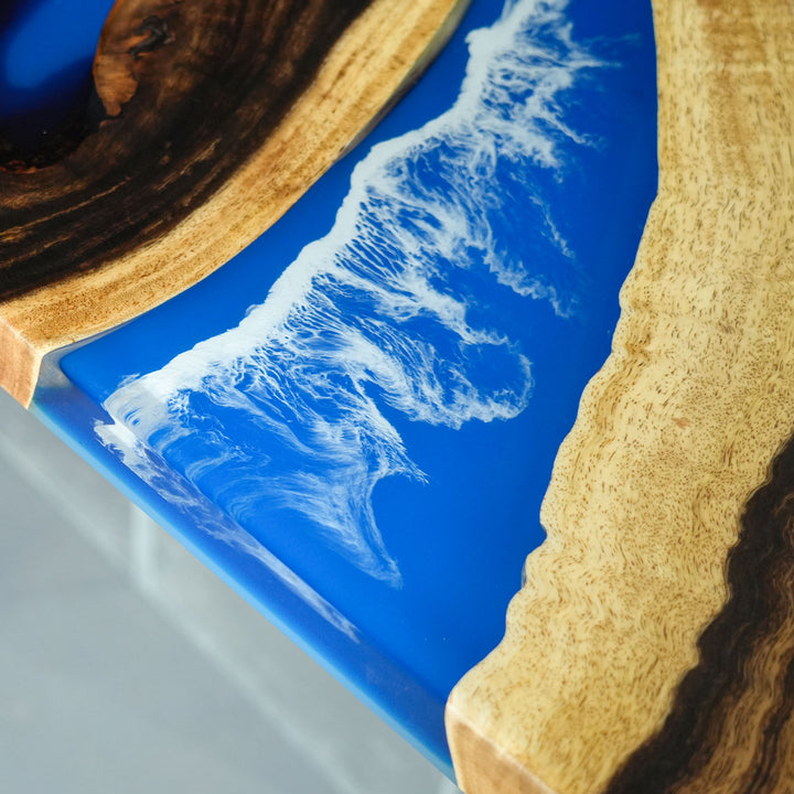Handmade epoxy resin table with walnut wood and ocean effect resin