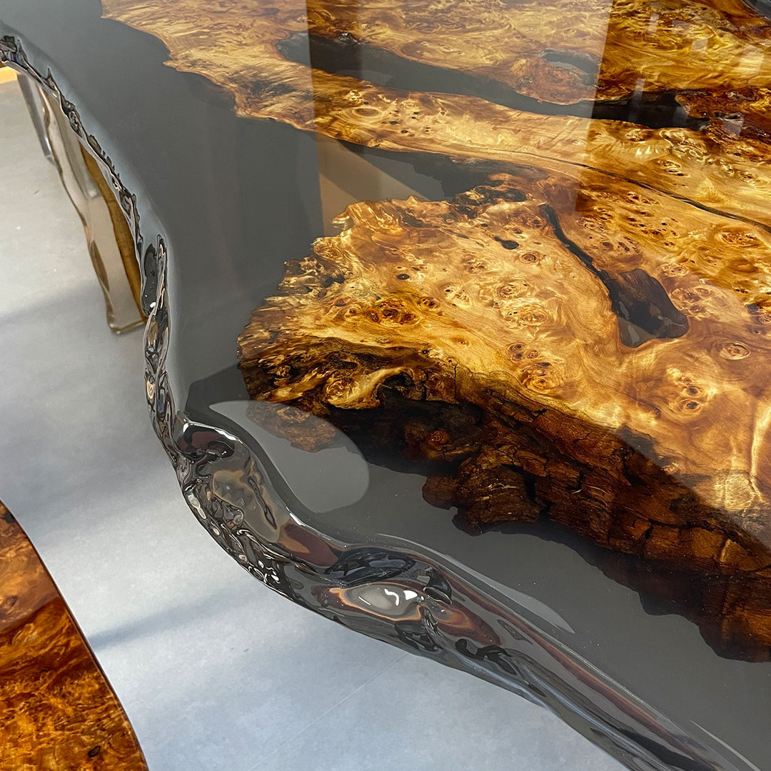 Close - up of a live - edge poplar wood resin table with unique grain and glossy resin