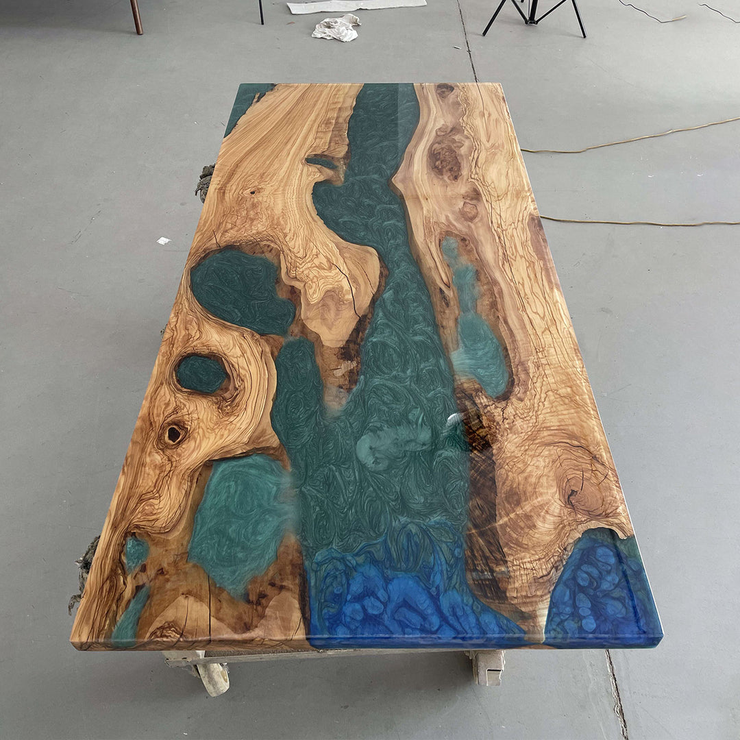Luxurious epoxy resin river dining table with natural walnut slab
