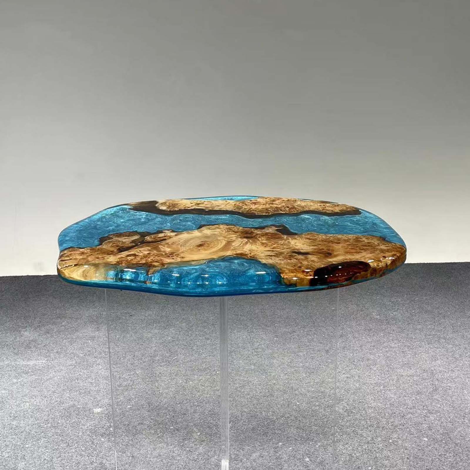 Coffee table legs and craftsmanship detail paired with blue resin tabletop