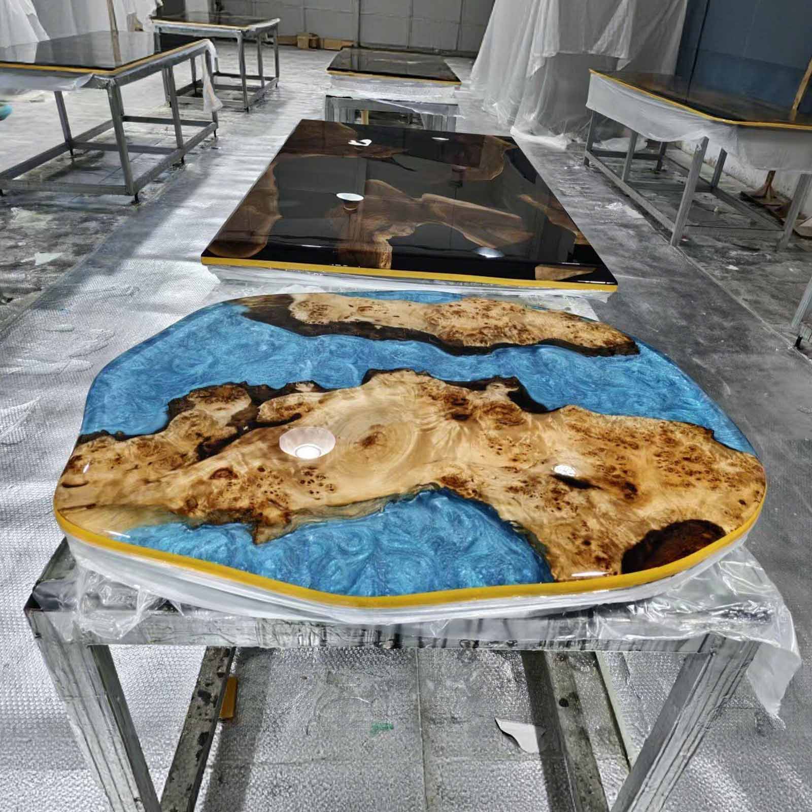 Side view of coffee table reflecting sunlight beside the pool