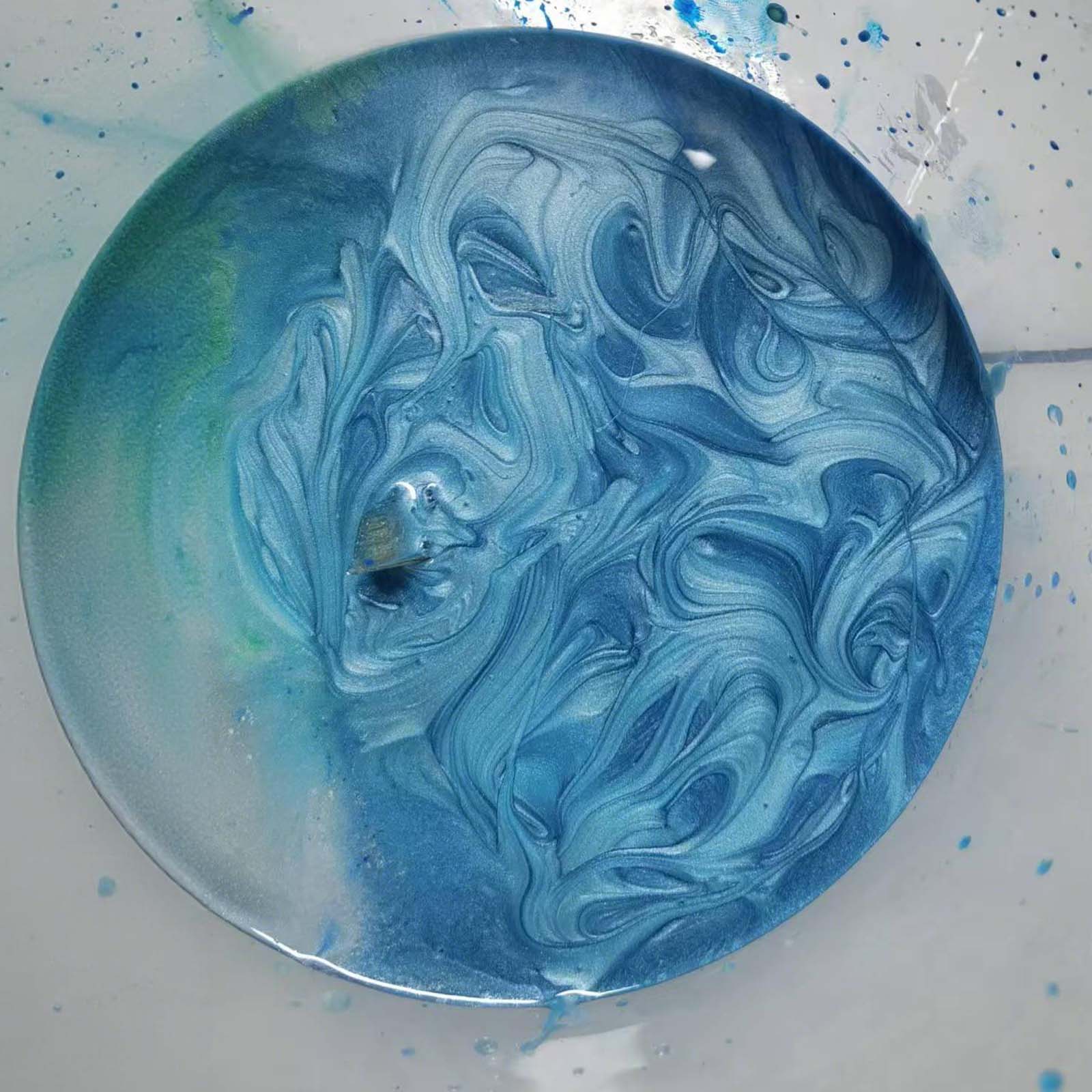 Side view of rectangular dining table with natural poplar grain and blue resin