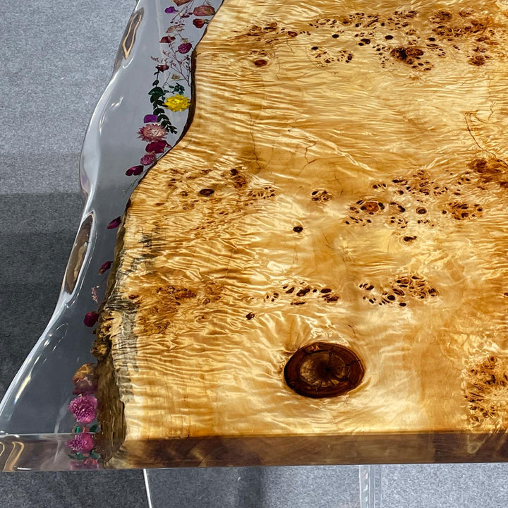 Luxury coastal dining table with clear epoxy and burl wood pattern