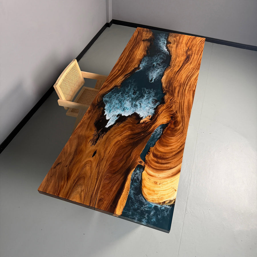 Handmade epoxy river table with ocean wave design and natural wood grain