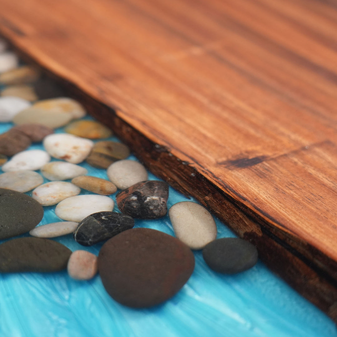 One-of-a-kind live edge walnut epoxy table with river pebble design