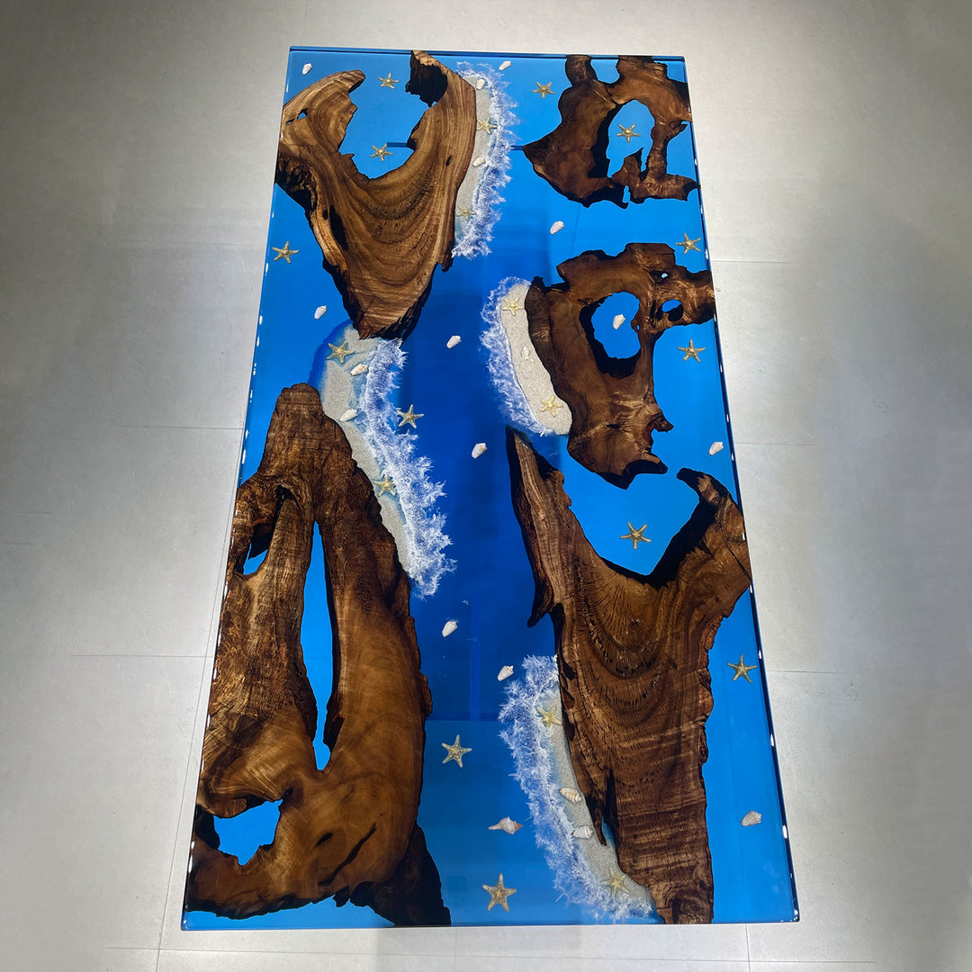Artistic ocean resin table with natural wood slabs and shoreline design