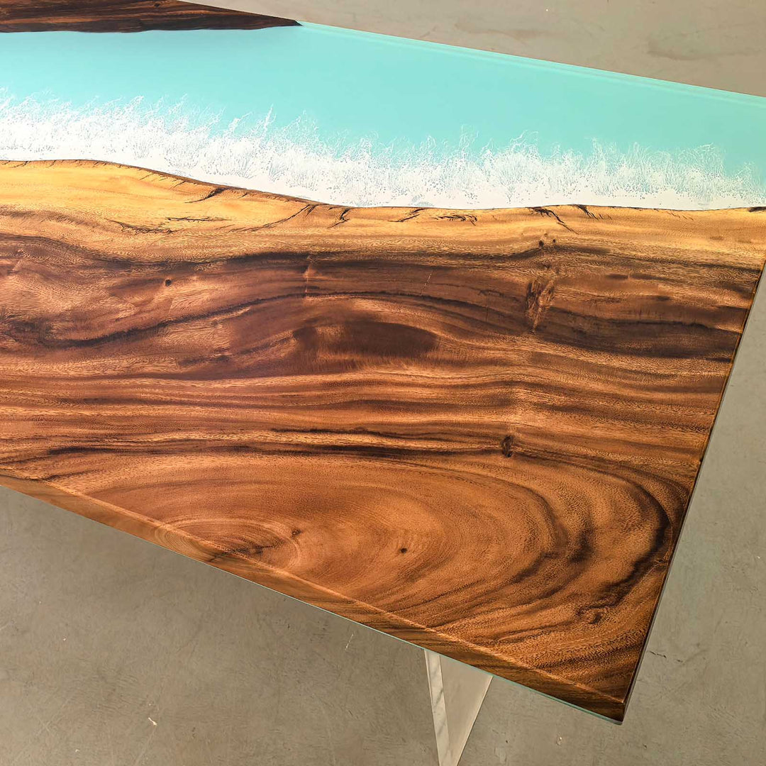 Side profile of a thick 2-inch solid walnut table with glossy blue ocean epoxy, showcasing the matte wood finish.
