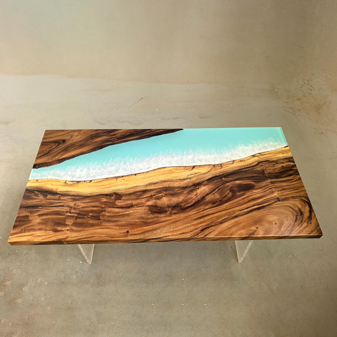 Top view of a unique handcrafted epoxy resin table showing the dynamic blue ocean wave design against natural walnut wood.