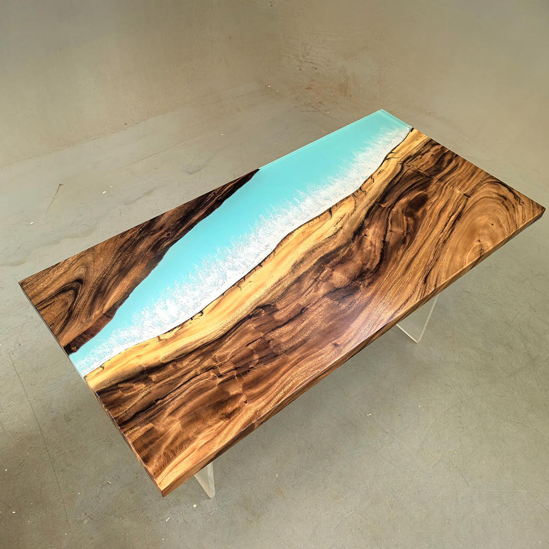 Walnut wood grain and "Ocean Serenity" blue resin table with a clear acrylic base, highlighting the top design.