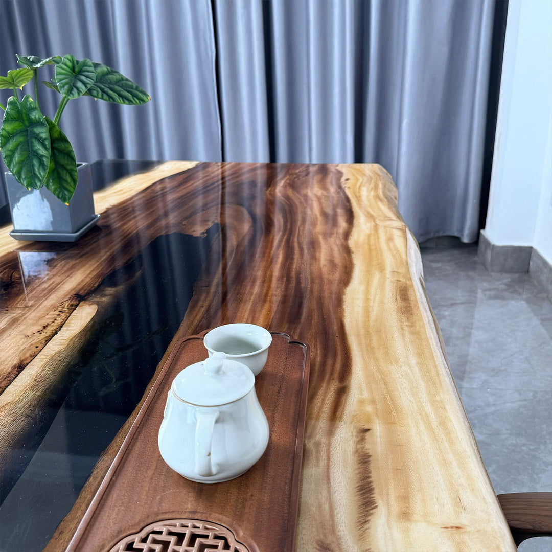 Oversized walnut epoxy resin table showcasing unique wood grain