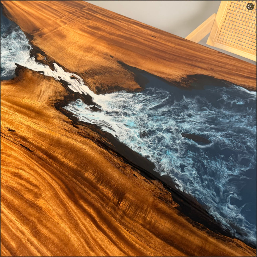 Handcrafted blue resin river table featuring dramatic ocean wave details