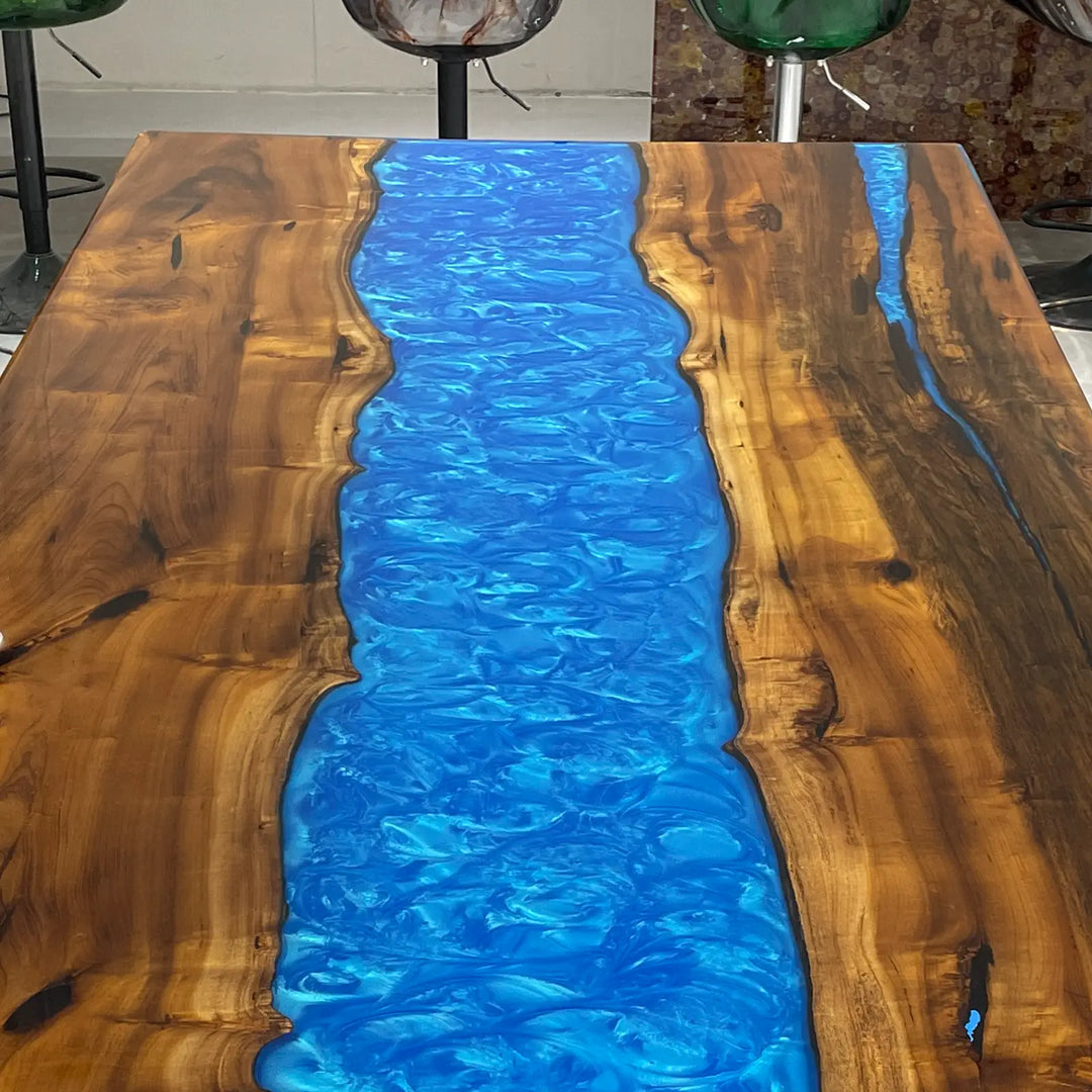 Contemporary epoxy dining table with vivid blue ocean wave effects