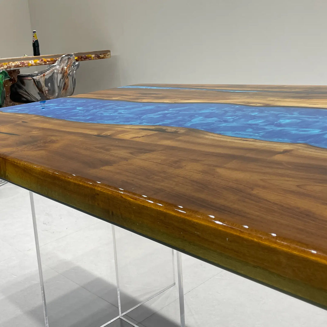 Large wooden dining table with artistic blue epoxy resin inlay