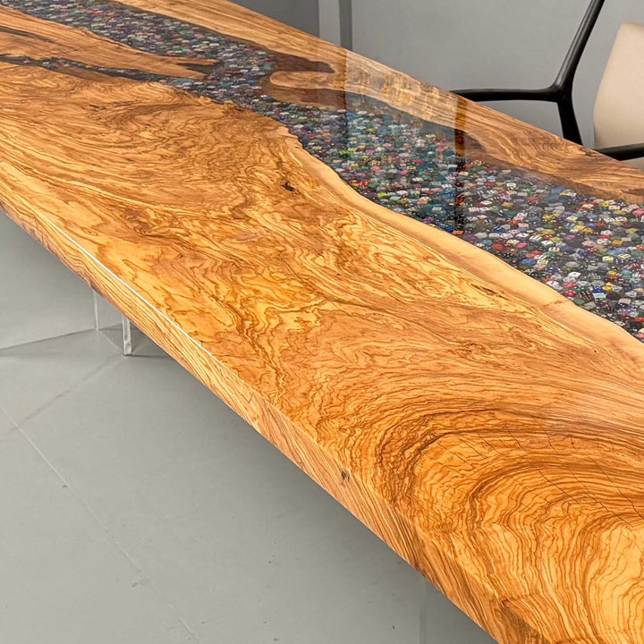 Clear epoxy river filled with collectible dice between live edge slabs