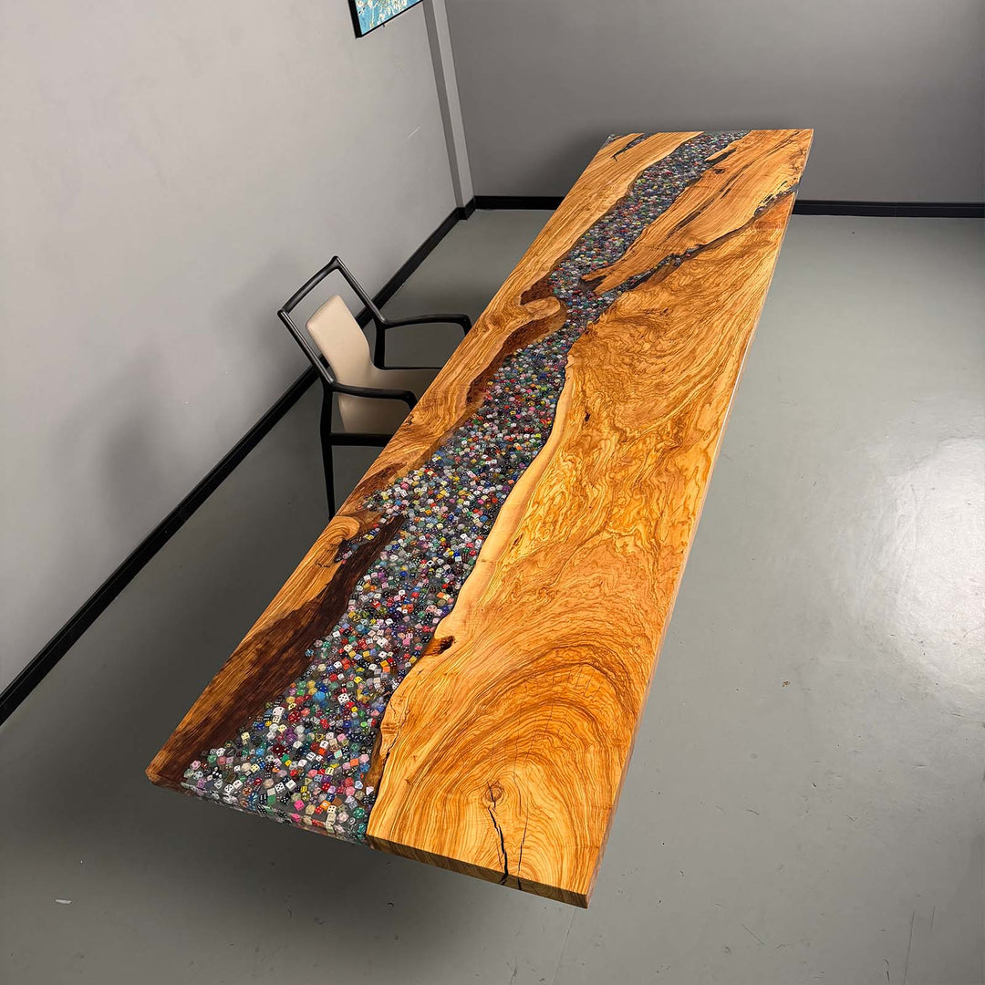 Modern gaming table with polyhedral dice encased in crystal clear resin