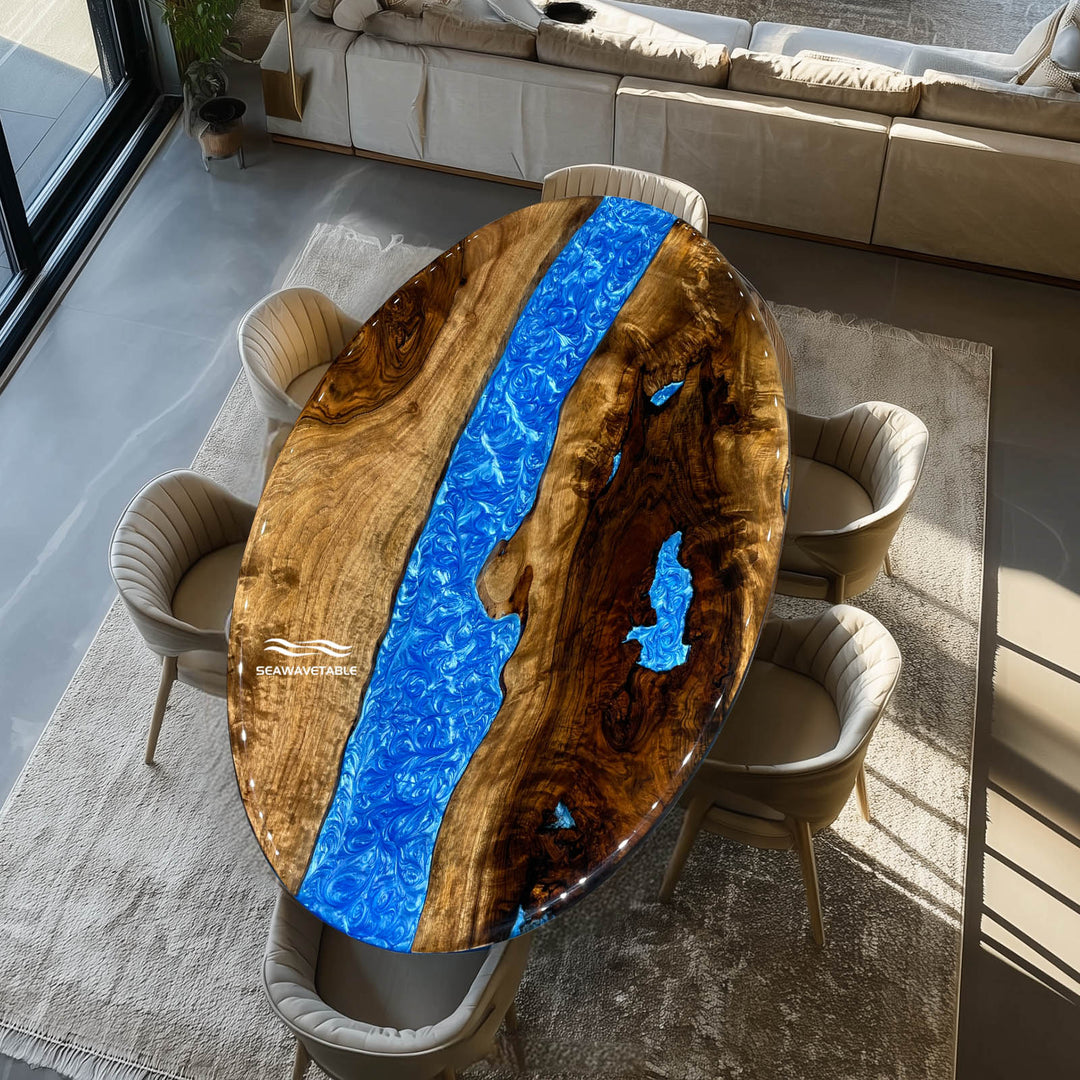 Luxury black walnut epoxy river oval table with swirling blue design