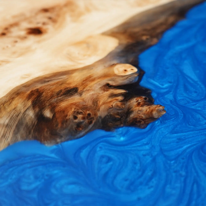 Detailed view of natural poplar wood grain and decorative blue resin