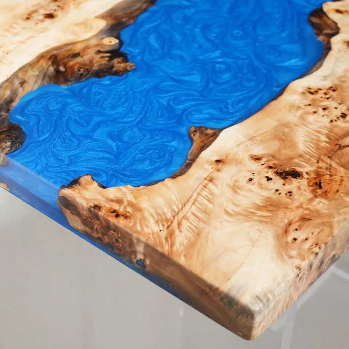 Natural poplar wood dining table with artistic swirling blue resin details