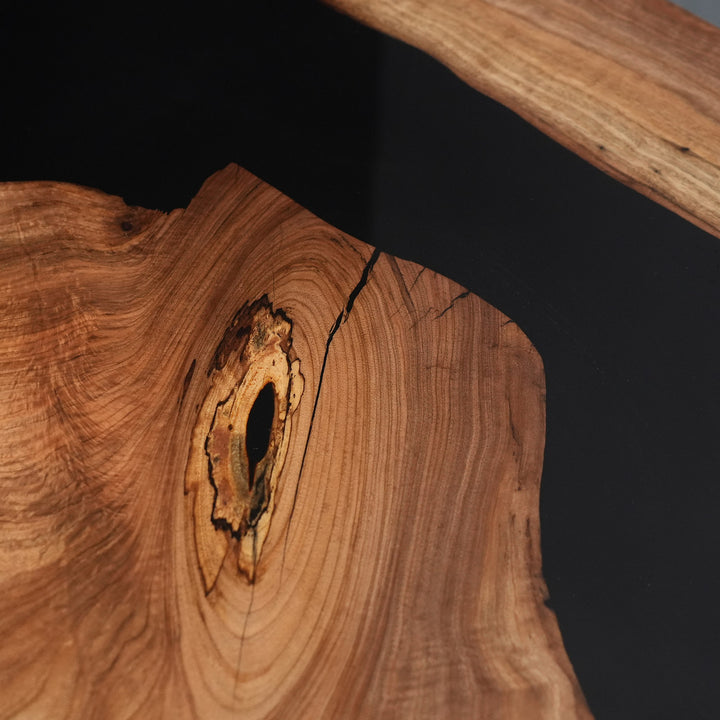 Modern organic dining table inspired by Los Angeles homes with black resin river detail