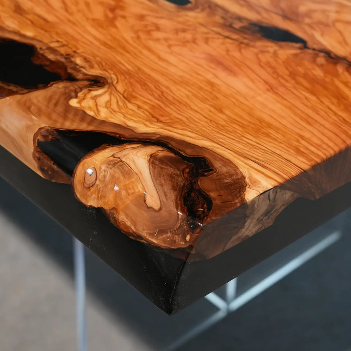 Modern rustic dining table showcasing distinctive olive wood grain and natural knots