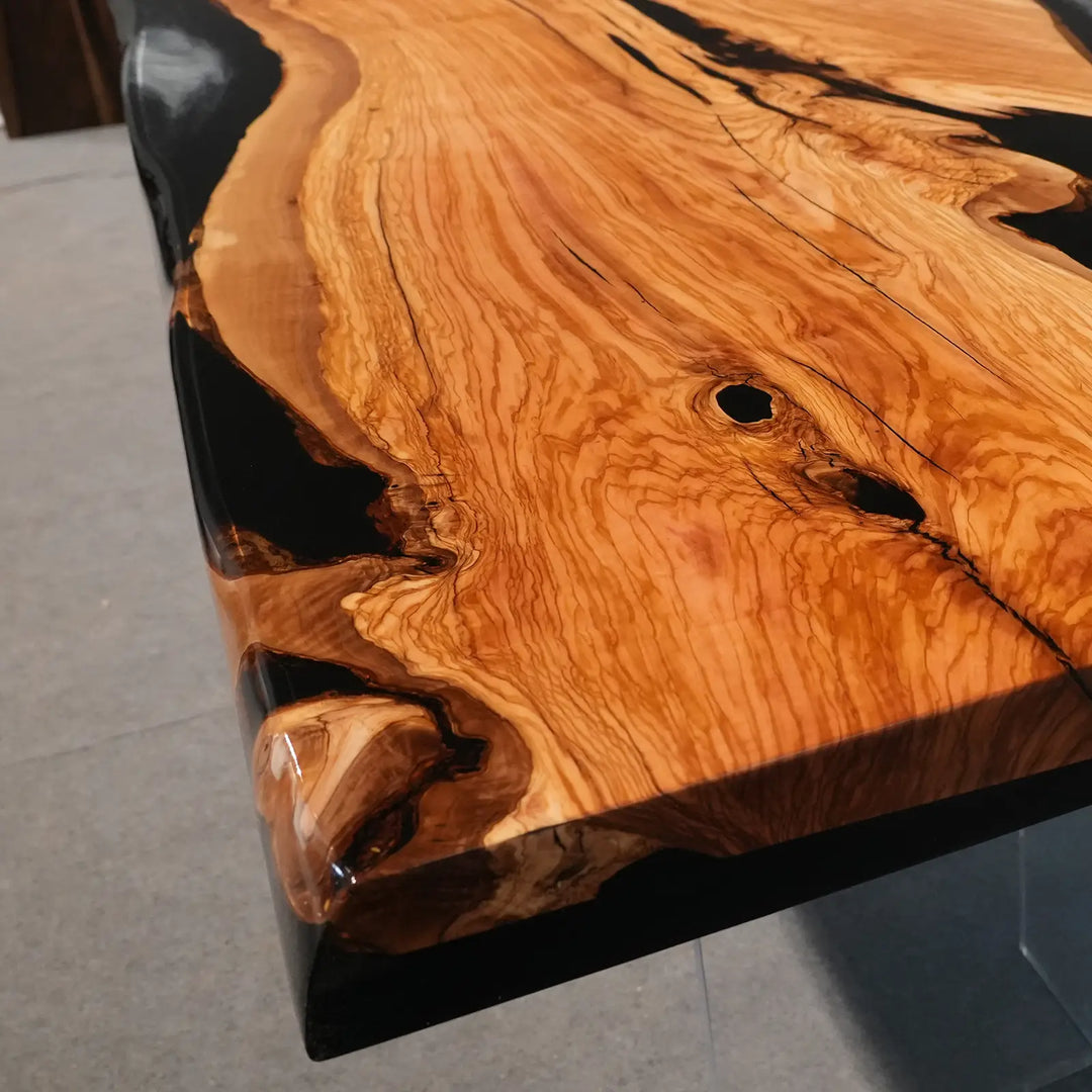 Luxury olive wood dining table with artistic black resin detailing