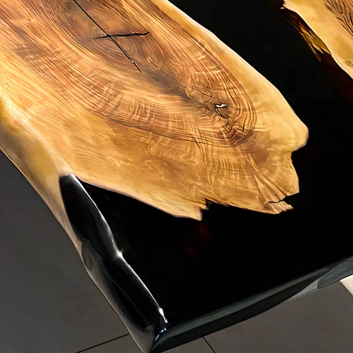 Unique custom epoxy table with natural wood grain and deep black resin