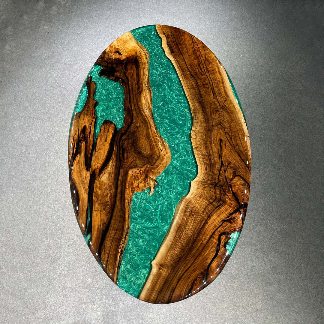 Custom handmade epoxy table with oval shape and premium hardwood
